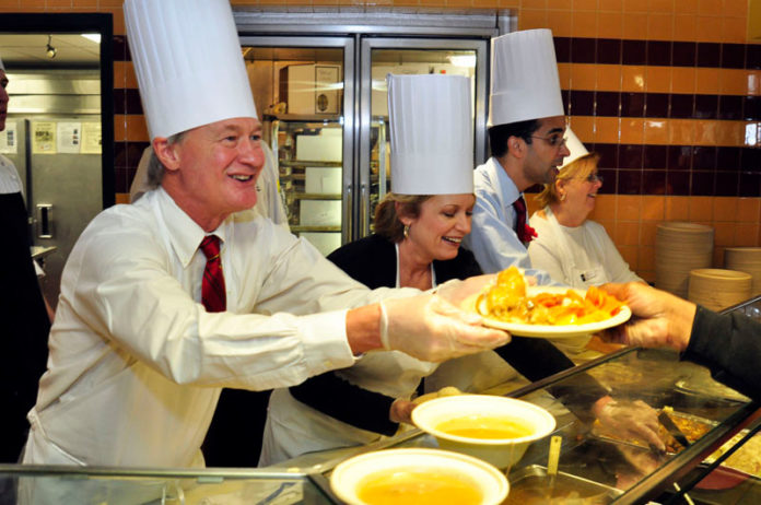 Serving Thanksgiving dinner to those in need is an annual tradition at Johnson & Wales University, which did so for the 21st time on Nov. 20. More than 1,000 meals were served by more than 150 faculty and staff volunteers. Above, from left, Gov. Lincoln D. Chafee, JWU Providence President Mim Runey and Providence Mayor Angel Taveras help serve diners. / COURTESY JWU