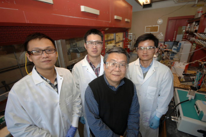 FUELED UP: Brown University professor Shouheng Sun, forefront, with students, from left: Sen Zhang, Shojun Guo and Liheng Wu. / PBN PHOTO/BRIAN MCDONALD