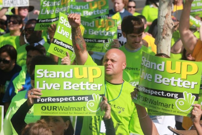 JOINING PROTEST at more than 1,000 Walmart locations nationwide, workers at the superstore's branches in Rhode Island and Massachusetts were expected to protest on Black Friday. / COURTESY ORGANIZATION UNITED FOR RESPECT AT WALMART
