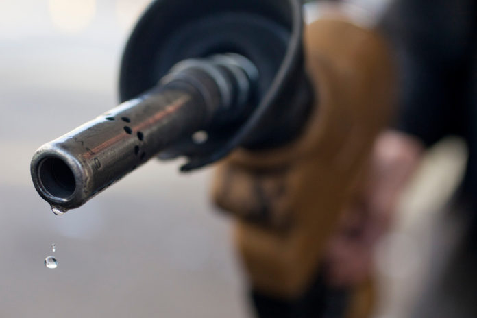 RHODE ISLAND gasoline prices dropped 6 cents this week and Massachusetts' gas prices dropped 7 cents, according to AAA Southern New England's weekly survey of the area's pump prices.  / BLOOMBERG FILE PHOTO/ANDREW HARRER