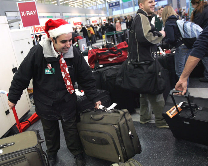 AAA SOUTHERN NEW ENGLAND expects roughly 93.3 million Americans to travel 50 or more miles from their home during the Christmas/New Year holidays this year.  / BLOOMBERG NEWS FILE PHOTO/TIM BOYLE