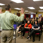 Success thanks to lifelong need to build a business ALL TOGETHER NOW: Elite Physical Therapy Vice President of Operations Jason Harvey leads staff through an in-house education session, one of many that the company puts on. / PBN PHOTO/MICHAEL PERSSON