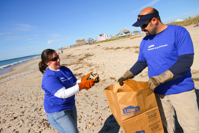 MAKING IT RIGHT: Amgen has participated in the International Coastal Cleanup the past two years in coordination with the Audubon Society of Rhode Island. Last, year Rebecca Cabral and husband, Jason (who is not an Amgen staffer), took part in the cleanup at the Charlestown Breachway. / COURTESY AL WEEMS