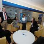 A TEAM EFFORT: Webster Bank says it can turn around a mortgage application in 30 days, thanks in large measure to its Providence-based mortgage-origination team, half of which is pictured here at the bank&rsquo;s Rhode Island headquarters. / PBN PHOTO/BRIAN MCDONALD