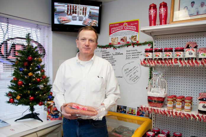 HOW THE SAUSAGE GETS MADE: Paul Skoczylas, owner of Central Falls Provision, in the company’s High Street store. He went to work for the family business in 1980, taking over a decade later. / PBN PHOTO/NATALJA KENT