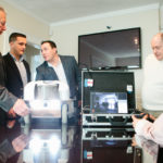 Robot tackles tough corporate jobs CLEANING UP: Formed in 2011, Purifad is quickly garnering recognition, including work for a national financial institution with facilities in R.I. From left: Vice President of Sales John Palazzo, President Jordan Amaral, CEO Manuel Martins Jr., owner Manuel Martins Sr. and robotics-operations employee Jason Ead. / PBN PHOTO/RUPERT WHITELEY