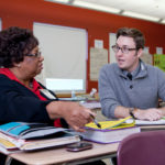 LEARNING TO TEACH: The R.I. Department of Education offers the Beginning Teacher Induction Program to prepare teachers for the reality of the classroom. Above, induction coach Lillian Turnispeed reviews a lesson plan with teacher Michael Broschart. / PBN PHOTO/NATALJA KENT