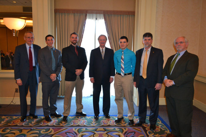 RICE SCHOLARSHIPS were recently presented to four students. Pictured from left to right are Joseph Pratt, chairman of RICE’s scholarship committee; recipients Christopher London and Gregory Coren; Gov. Lincoln D. Chafee; recipient Andrew Grota; Thomas Cabana, RICE president; and Patrick Quinlan, RICE executive director. Recipient Elizabeth Andruszkiewicz is not pictured.