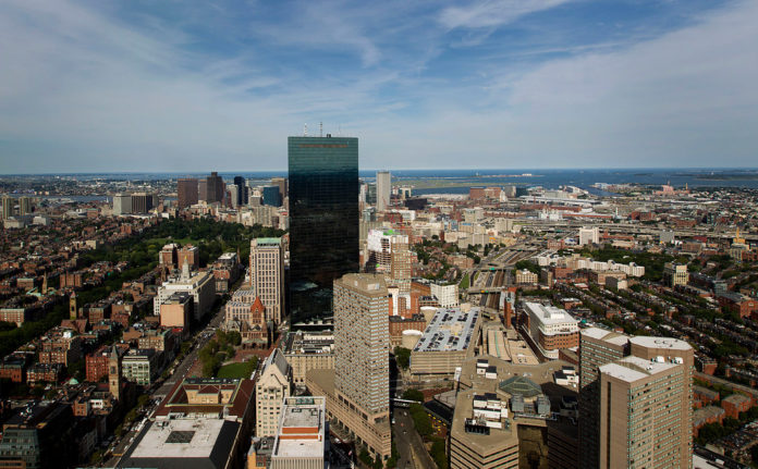 MASSACHUSETTS' ECONOMY is poised for growth in 2013, but threatened by the looming government budget sequester.  / BLOOMBERG FILE PHOTO/BRENT LEWIN