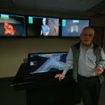 No longer taboo in workplace, games tap creativity GAME PLAN: James R. Lavoie, Rite-Solutions CEO, shows off a game product used by mining companies to train employees to deal with emergencies. / PBN PHOTO/BRIAN MCDONALD