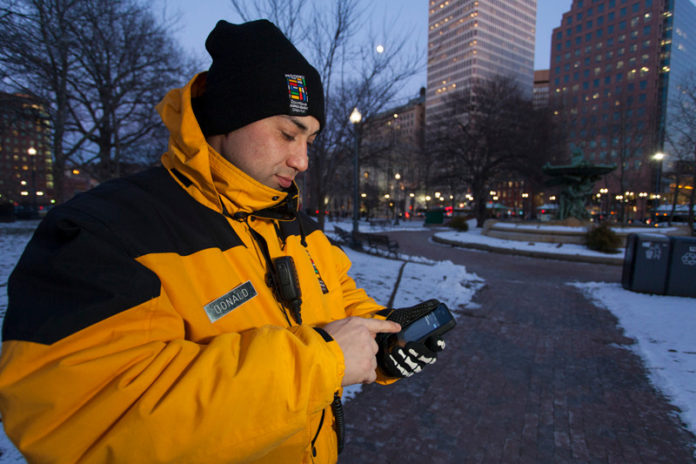 SMARTER APPROACH: Donald Perez, Providence Downtown Improvement District safety team leader, uses the SMART system in Kennedy Plaza. / PBN PHOTO/DAVID LEVESQUE