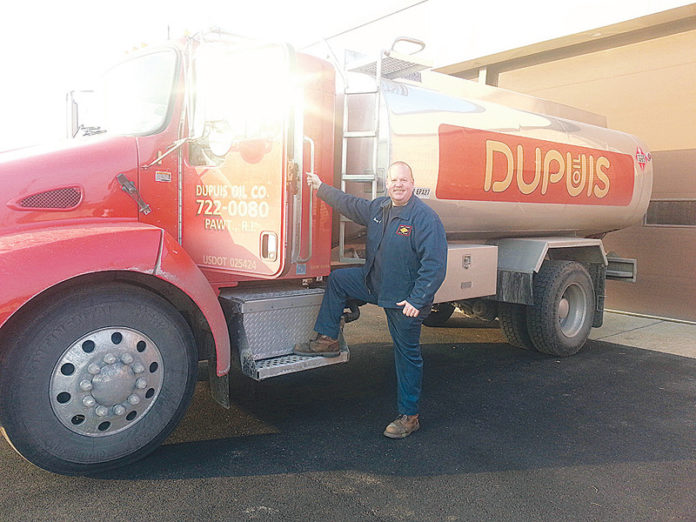PAWTUCKET-BASED DUPUIS OIL recently announced a partnership with the Rhode Island Chapter of the National Multiple Sclerosis Society that will also benefit customers. Above is driver Doug Degnan.
