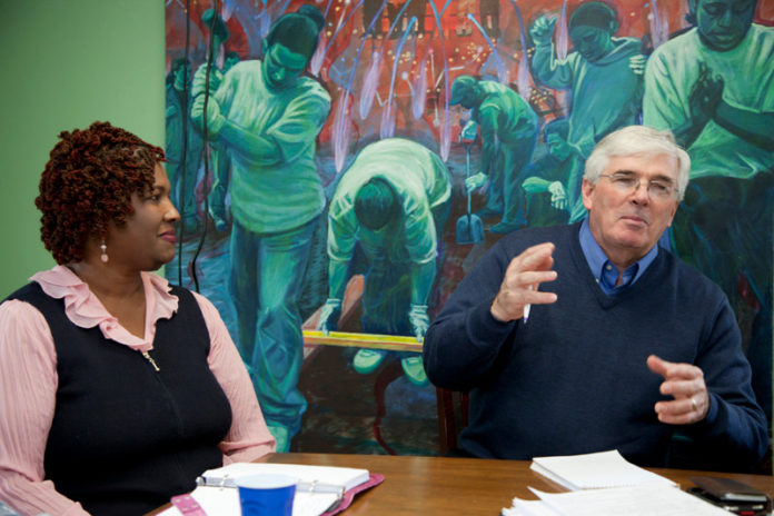 SERVE AND PROTECT: Serve Rhode Island Executive Director Bernie Beaudreau leads a discussion on new nonprofit programs as American Cancer Society Community Executive of Health Initiatives Cheryl Albright looks on. / PBN PHOTO/NATALJA KENT