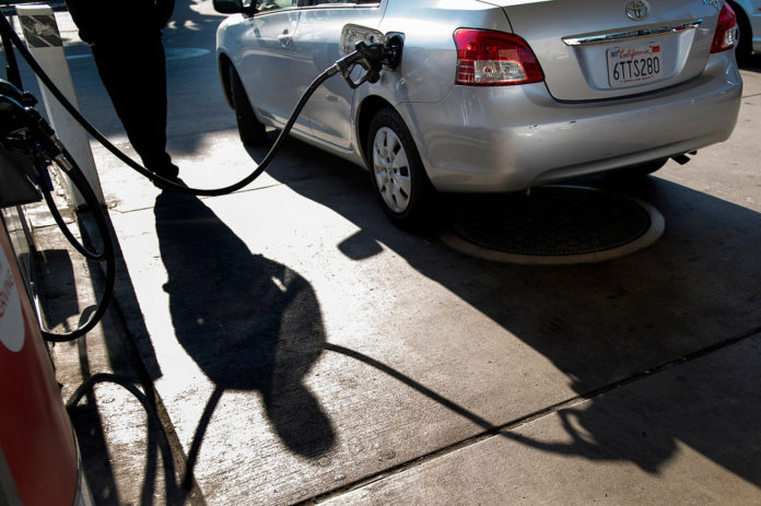 GAS PRICES FELL 3 cents per gallon in Rhode Island over the last week, according to AAA Southern New England, although at $3.76, it stands 8 cents higher than the national average for self-serve, unleaded regular. / BLOOMBERG FILE PHOTO/DAVID PAUL MORRIS