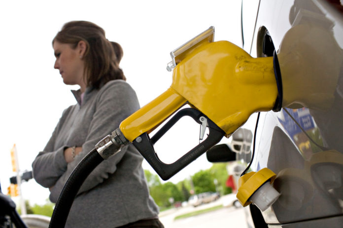 GAS PRICES fell 3 cents this week in Rhode Island and 4 cents in Massachusetts, according to AAA Southern New England's weekly survey of area pump prices.  / BLOOMBERG FILE PHOTO/DANIEL ACKER