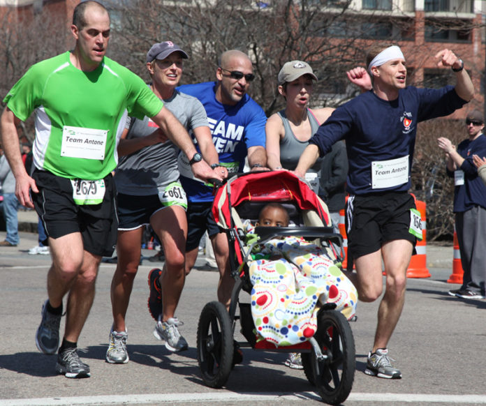 RUNNERS IN THE New Bedford Half Marathon team up each year to “push beyond the limits,” in an effort to support the Schwartz Center. This year’s marathon will be held March 17. Pictured above are participants in last year’s event.