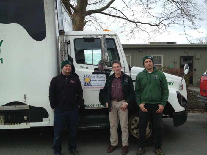 MUNROE DAIRY recently applied nearly 40 12x18-inch magnets to its vehicles as part of a magnet campaign launched by the Katie DeCubellis Memorial Foundation. Pictured from left to right are Munroe employees Jeff Szynal, Rick Gregoire and Victor Arredondo.