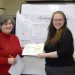 HER OWN BOSS: Lori Allen, right, Center for Women and Enterprise manager of corporate, foundation and government giving, gives a certificate of completion to Elaine Walle, who participated in a class at the center. / PBN PHOTO/BRIAN MCDONALD