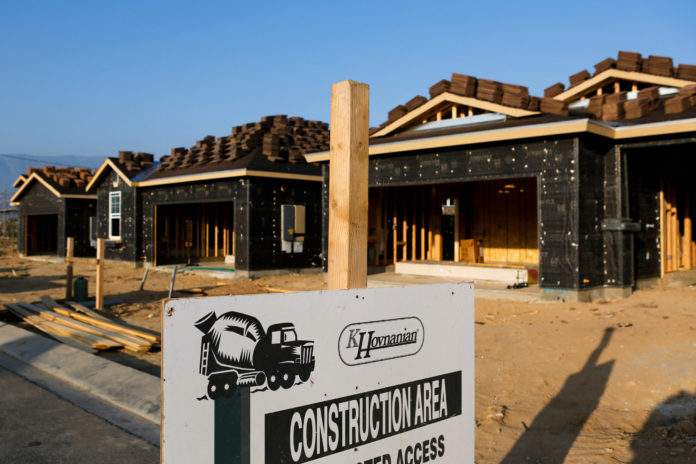 NEW HOME CONSTRUCTION in the U.S. increased in February, according to the Commerce Department. Above, homes under construction stand in the Hovnanian Enterprises Inc.'s Four Seasons housing development in Beaumont, Calif. / BLOOMBERG NEWS PHOTO/PATRICK T. FALLON