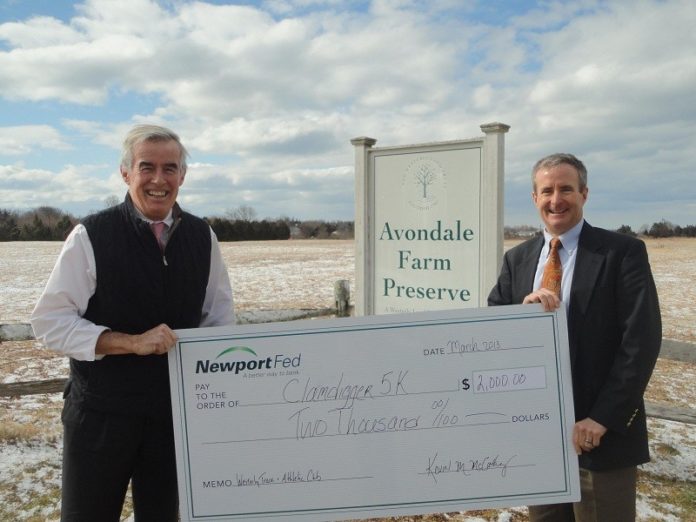 KEVIN MCCARTHY, left, president and CEO of NewportFed presents a $2,000 sponsorship check to Stephen Schonning, president of the Westerly Track & Athletic Club.