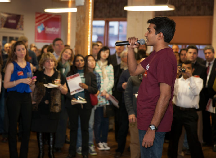 RAJU P.N., co-founder & CEO of Eventcheq, one of the 15 companies participating in Betaspring's spring accelerator program, makes his pitch to the crowd during the open house that marks the halfway point of the session. / PBN PHOTO/DAVID LEVESQUE
