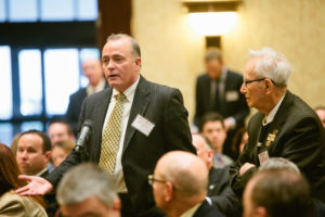 Robert Anderson of RIMS Brokerage asks the panelists a question / Rupert Whiteley