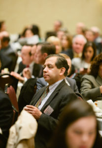 Carlos Fuentes, VP of Delta Dental, listens to first panel / Rupert Whiteley