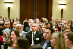 UnitedHealthcare New England CEO, Stephen Farrell (center), listens to first panel / Rupert Whiteley