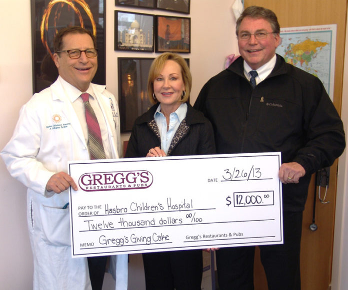 THROUGH SALES of special cake, Gregg’s Restaurants and Pubs have donated approximately $125,000 to Hasbro Children’s Hospital.  Pictured from left to right are Dr. Robert B. Klein, pediatrician-in-chief of Hasbro Children’s Hospital with Bobbie and Bob Bacon, co-owners of Gregg’s Restaurants and Pubs.