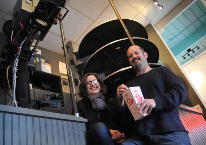 REELED IN: Cable Car Cinema co-owners Emily Steffian and Daniel Kamil in the theater, which is transitioning to digital-projector technology this year. / PBN PHOTO/FRANK MILLIN