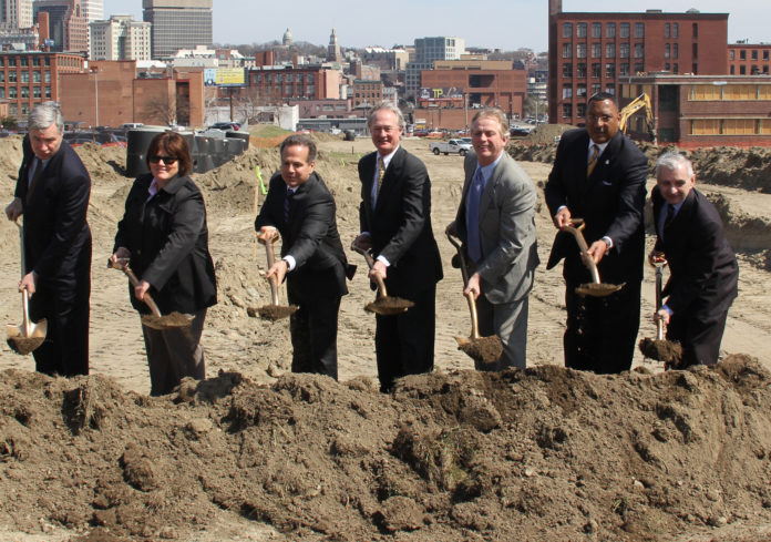 TAKING PART IN A CEREMONIAL GROUNDBREAKING for restoration of the street and utility grid on the former Interstate 195 land in Providence on Monday were, from left, U.S. Sen. Sheldon Whitehouse, R.I. Senate Majority Whip Maryellen Goodwin, U.S. Rep. David N. Cicilline, Gov. Lincoln D. Chafee, Providence Economic Development Director James Bennett, R.I. Department of Transportation Deputy Director Phillip Kydd and U.S. Sen. Jack Reed. / COURTESY JAMES ALVAREZ/OFFICE OF THE GOVERNOR