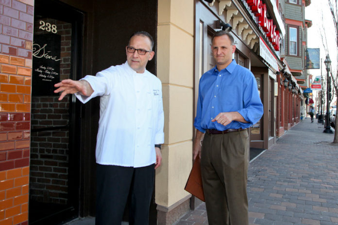 TAKE A SEAT: Siena General Manager Chris Tarro, right, says that alfresco dining serves to both increase the capacity of the restaurant and provide advertising. Pictured at left is Siena President Anthony M. Tarro. / PBN PHOTO/NATALJA KENT