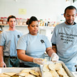SOMETHING COOKING: According to the Amos House, its Culinary Education Program has provided 318 people with training over the last 11 years. Pictured above are program students, from left, Nathan Williams, Emily Calderon and Tilmon Evans. / PBN PHOTO/RUPERT WHITELEY