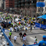 FIRST RESPONDERS tend to the wounded where two explosions occurred along the final stretch of the Boston Marathon on Boylston Street in Boston, Massachusetts, U.S., on Monday, April 15. Two powerful explosions rocked the finish line area of the Boston Marathon near Copley Square and police said many people were injured. / BLOOMBERG PHOTO/KELVIN MA