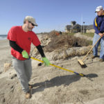 Beach cleanup work keeps veterans afloat PITCHING IN: Military veterans Matthew Paquette, left, and Jonathan Segal work at Scarborough State Beach in Narragansett on storm cleanup. / PBN PHOTO/MARTIN GAVIN