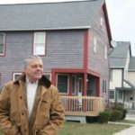 GREEN THUMB: Architect Ken Filarski of the Rhode Island Green Building Council shows off some eco-friendly homes he has designed in Providence. / PBN PHOTO/MICHAEL PERSSON