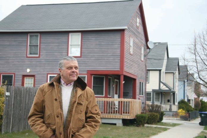 GREEN THUMB: Architect Ken Filarski of the Rhode Island Green Building Council shows off some eco-friendly homes he has designed in Providence. / PBN PHOTO/MICHAEL PERSSON