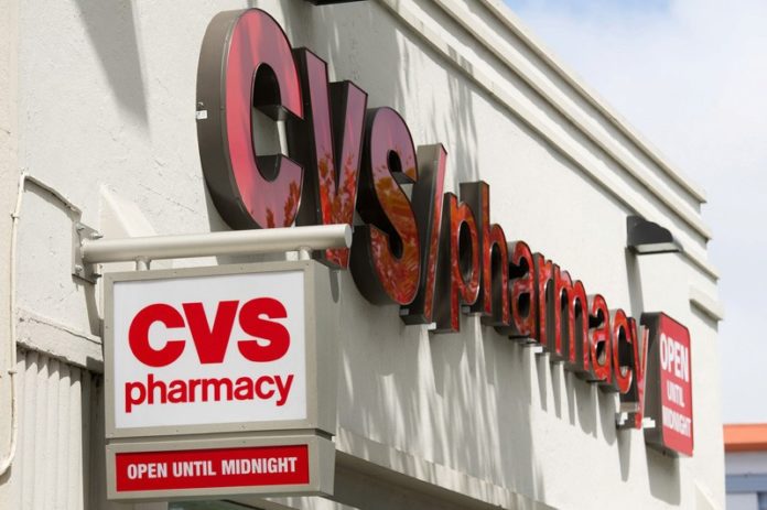 CVS CAREMARK CORP.'s net income rose 23.3 percent to $956 million, or 77 cents per diluted share, during the first quarter of 2013 as its revenue fell slightly to $30.8 billion.  / BLOOMBERG FILE PHOTO/DAVID PAUL MORRIS