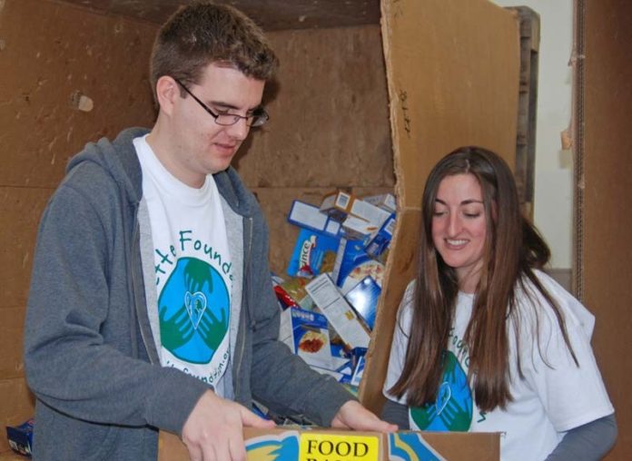 LAST MONTH, employees of Collette Vacations spent National Volunteer Week assisting local organizations. Charlie Wood, a copy editor, and Maria Fruci, a public relations specialist, helped out by inspecting, sorting and packing food donations for the Rhode Island Community Food Bank.