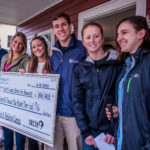 URI Greeks walk for Habitat FROM LEFT TO RIGHT, URI students Frankie Darnold, Jill Anderson, Jaime Giacomelli, Corrine Reed, Rob Tobey, Kristin Pollard and Julia Garrick pose with the check being donated to South County Habitat for Humanity. / COURTESY URI/MICHAEL SALERNO PHOTOGRAPHY