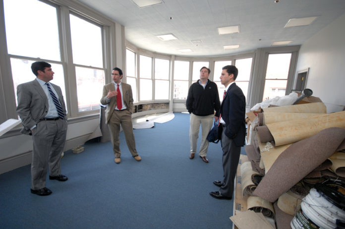 SPRINGBOARD: From left: Brothers Brian, Daniel, Jay and Kevin Murphy are converting the former Providence headquarters of Home Loan Investment Bank into a startup hub. Fledgling companies will begin on the third floor and move up if they are successful. / PBN PHOTO/BRIAN MCDONALD