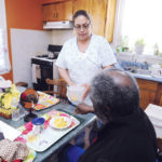 It’s more than a job for nursing assts. PATIENTS PAYING OFF: Homefront Health Care certified nursing assistant Margarita Feliciano works with a patient. She entered the field in 2011 after being laid off from her banking job. / PBN PHOTO/MARTIN GAVIN