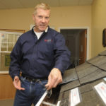 SOLID FOUNDATION: Jim Moon, president of Moonworks, shows off his company&rsquo;s gutter products. Two decades after its founding, his company ranks as one of the fastest-growing businesses in Rhode Island, according to Inc. Mazagine. / PBN PHOTO/MARTIN GAVIN