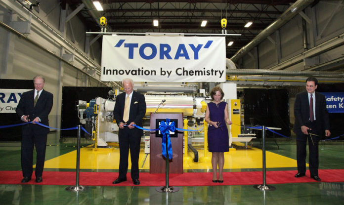 Toray Plastics (America) Inc. on May 2 unveiled new $15 million coating equipment at a ribbon-cutting at its North Kingstown campus. The technology will allow the company to better meet global customer demand for industrial and packaging films made with advanced specialty layers. The investment is part of a technology-integration plan the company, which employs more than 600, expects will create 20 jobs. From left: Gov. Lincoln D. Chafee; Rick Schloesser, president and CEO of Toray Plastics (America); Senate President M.Teresa Paiva Weed and House Speaker Gordon D. Fox. / COURTESY TORAY PLASTICS