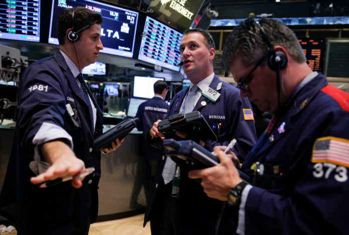 STOCKS WERE LITTLE CHANGED Monday morning after the S&P 500 Index climbed for four straight weeks to an all-time high.  / BLOOMBERG NEWS FILE PHOTO/JIN LEE