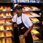 DUNKIN' DONUTS is rolling out new store designs to combat its sugar-caffeine fix pit stop reputation and get customers to stick around the outlets for a long time, a la Starbucks. / BLOOMBERG NEWS FILE PHOTO/EMILE WAMSTEKER