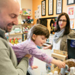 Building a community for new, expectant parents BIRTH RIGHT: Bellani Maternity owner Kelly LaChance Guertin speaks with David Dadekian and his daughter, Moira, in the South Kingstown store. / PBN FILE PHOTO/RUPERT WHITELEY