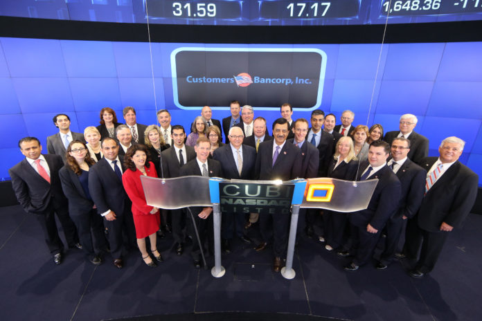 JAY SIDHU, chairman and ceo of Customers Bancorp Inc., celebrates with his team by ringing the Opening Bell at NASDAQ on Thursday morning, May 30, 2013. / COURTESY CUSTOMERS