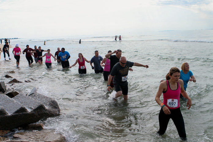 The organizers of the annual BoldrDash race at Yawgoo Valley Ski and Sport took their show to Misquamicut Beach on May 18 and 19, with a 5-kilometer obstacle course that included tire runs, scalable walls and wading through the surf to raise money for nonprofit “Bring Back the Beach.” / COURTESY GEORGE ROSS