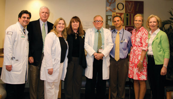GUESTS FROM the Michael H. Flanagan Foundation and Rhode Island Hospital gather for the family room dedication ceremony on May 7. Pictured above, from left, are: Dr. Nathan Connell, family member Mike Flanagan, nurse Meredith Hurley, R.I. Hospital social worker Susan Gardland, Dr. Peter Quesenberry, Dr. James Butera, foundation Director Christine Griffin, and family member Kathy Flanagan.